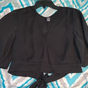 Black crop top with sleeves.